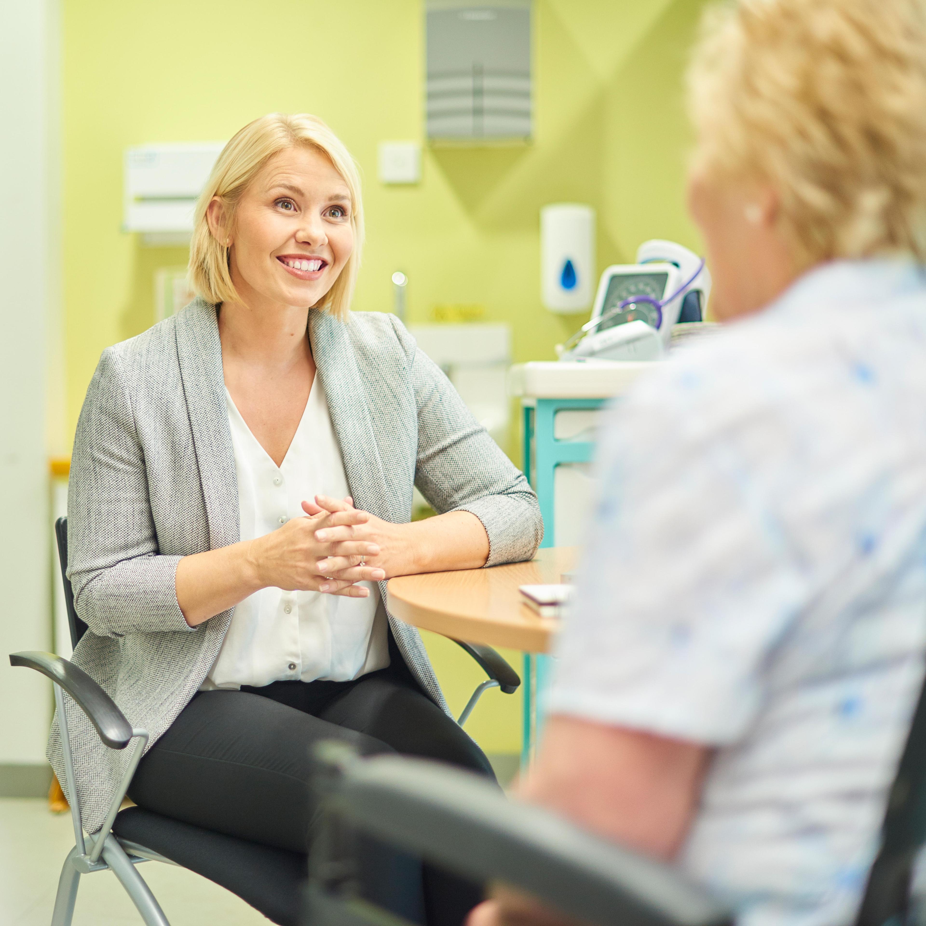 Female gp listening to patient