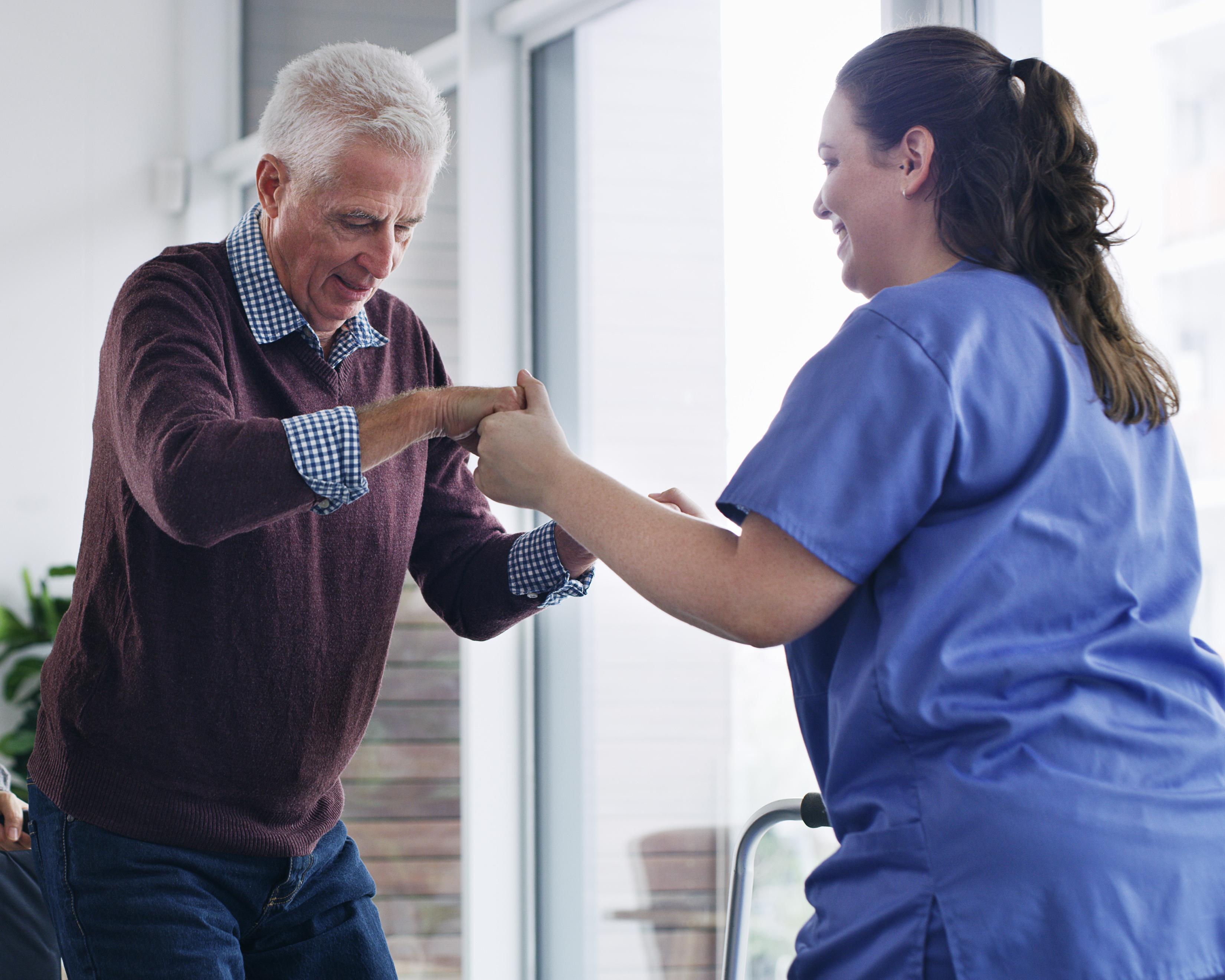 Patient with nurse working together 1142548992.jpg