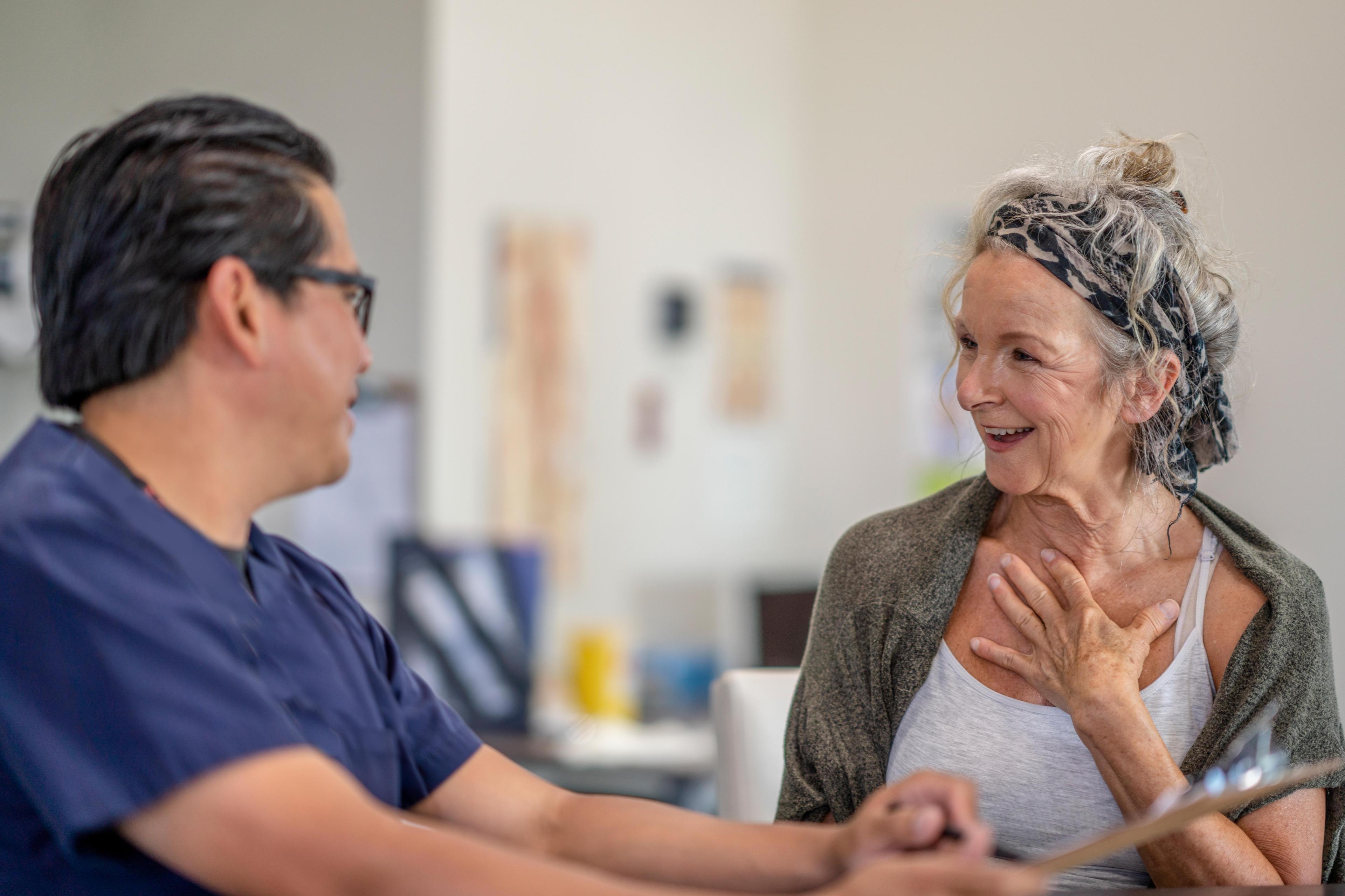 doctor consults with his female patient  1326184328.jpg