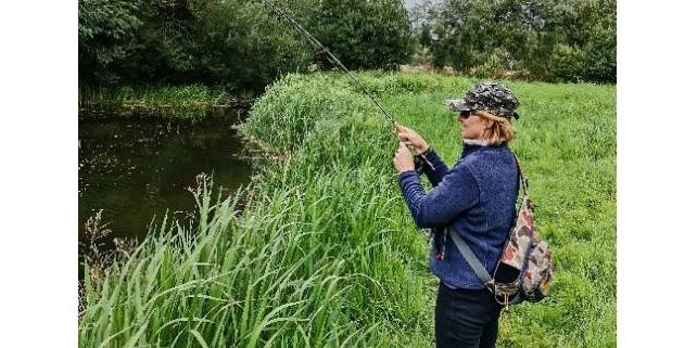 Yvette fishing by the river.jpg