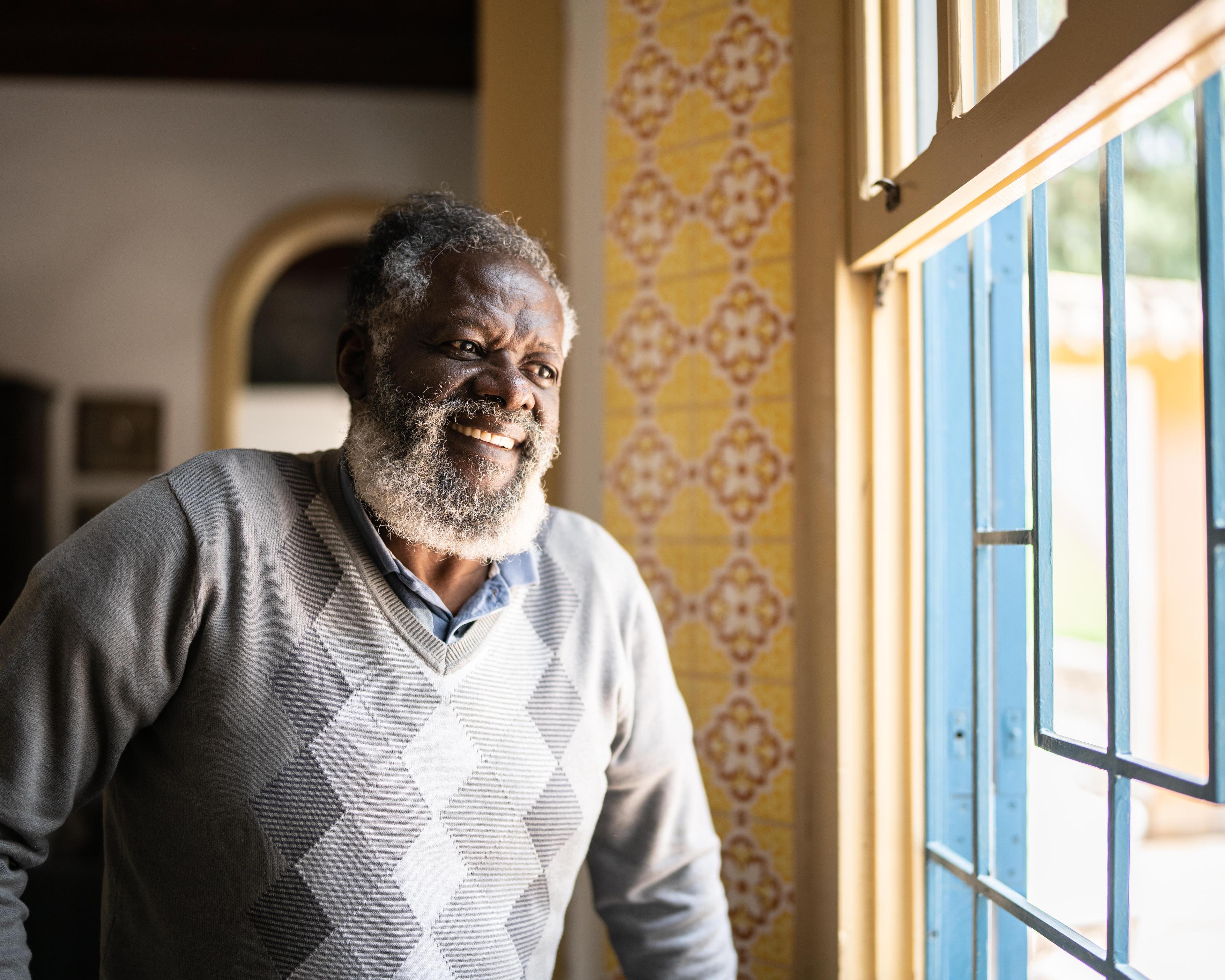 Man looking through a window 1368004989.jpg