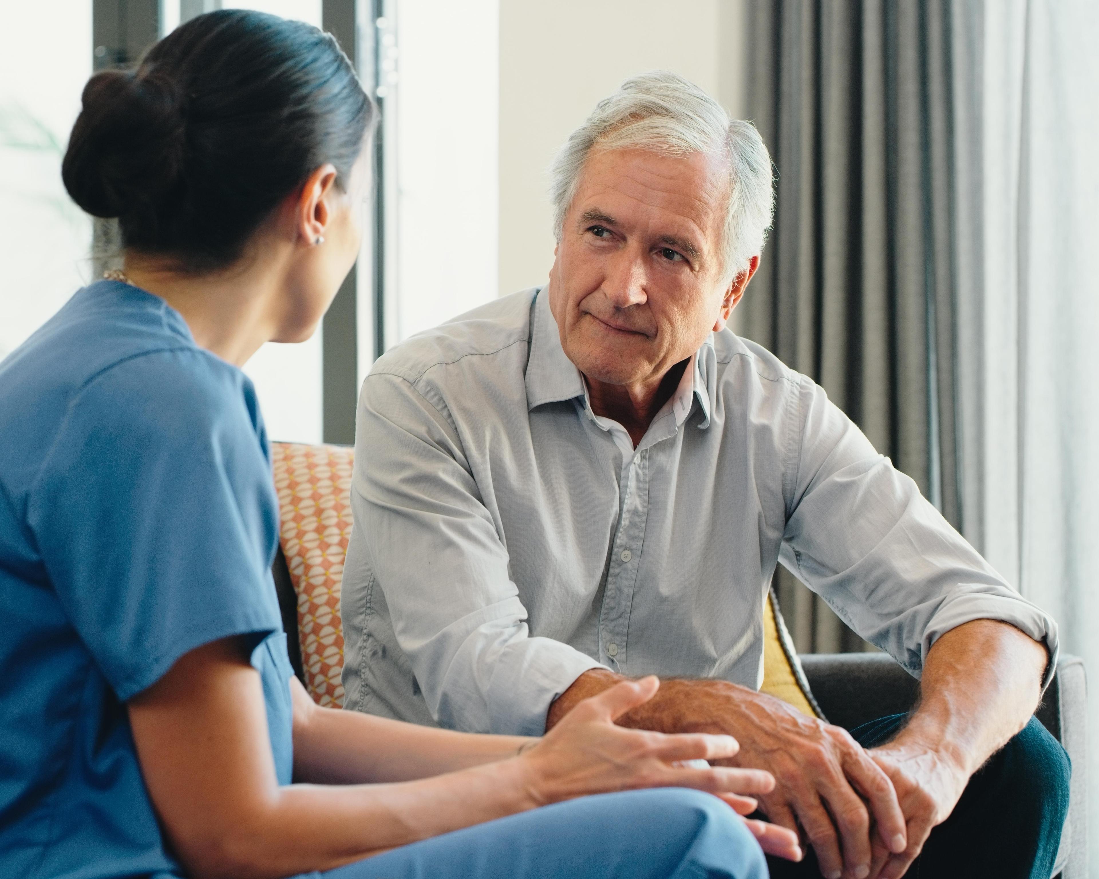 Nurse listening to male patient 1423007805.jpg