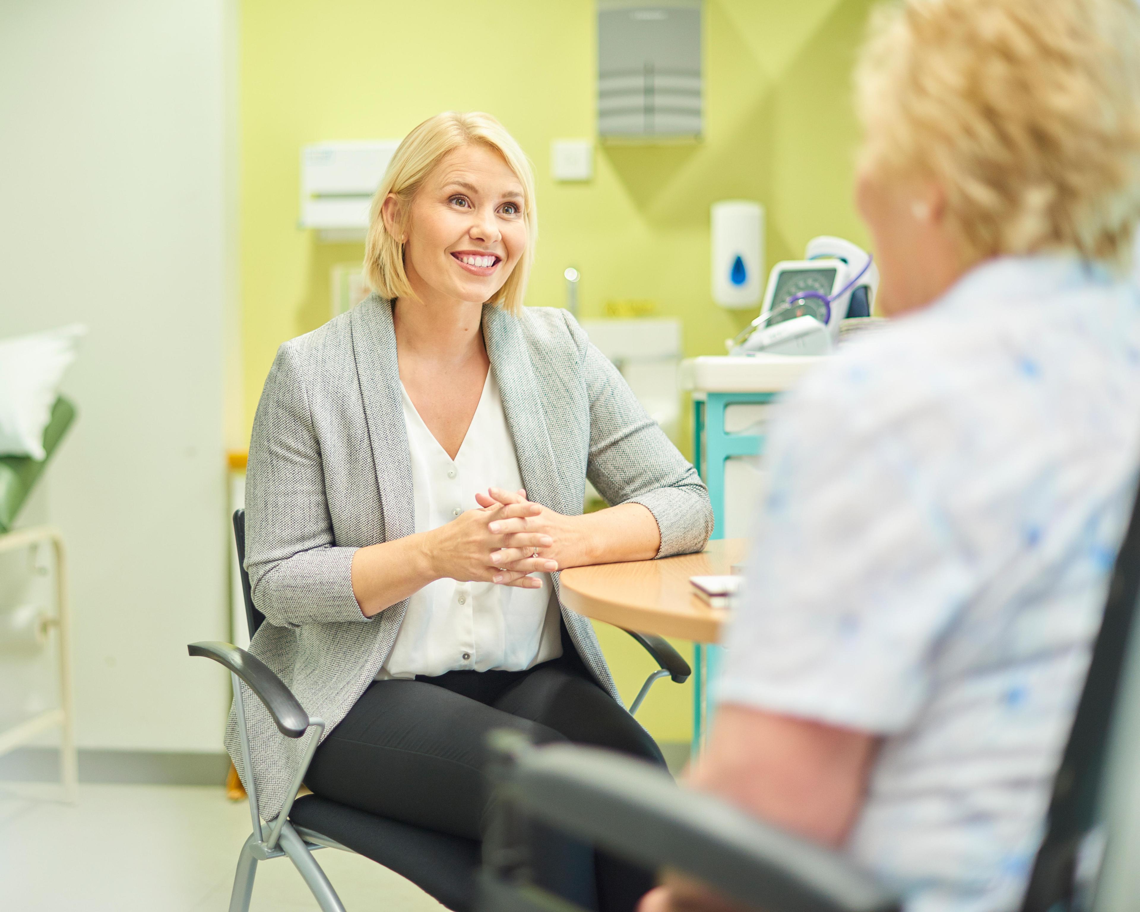 Female gp listening to patient