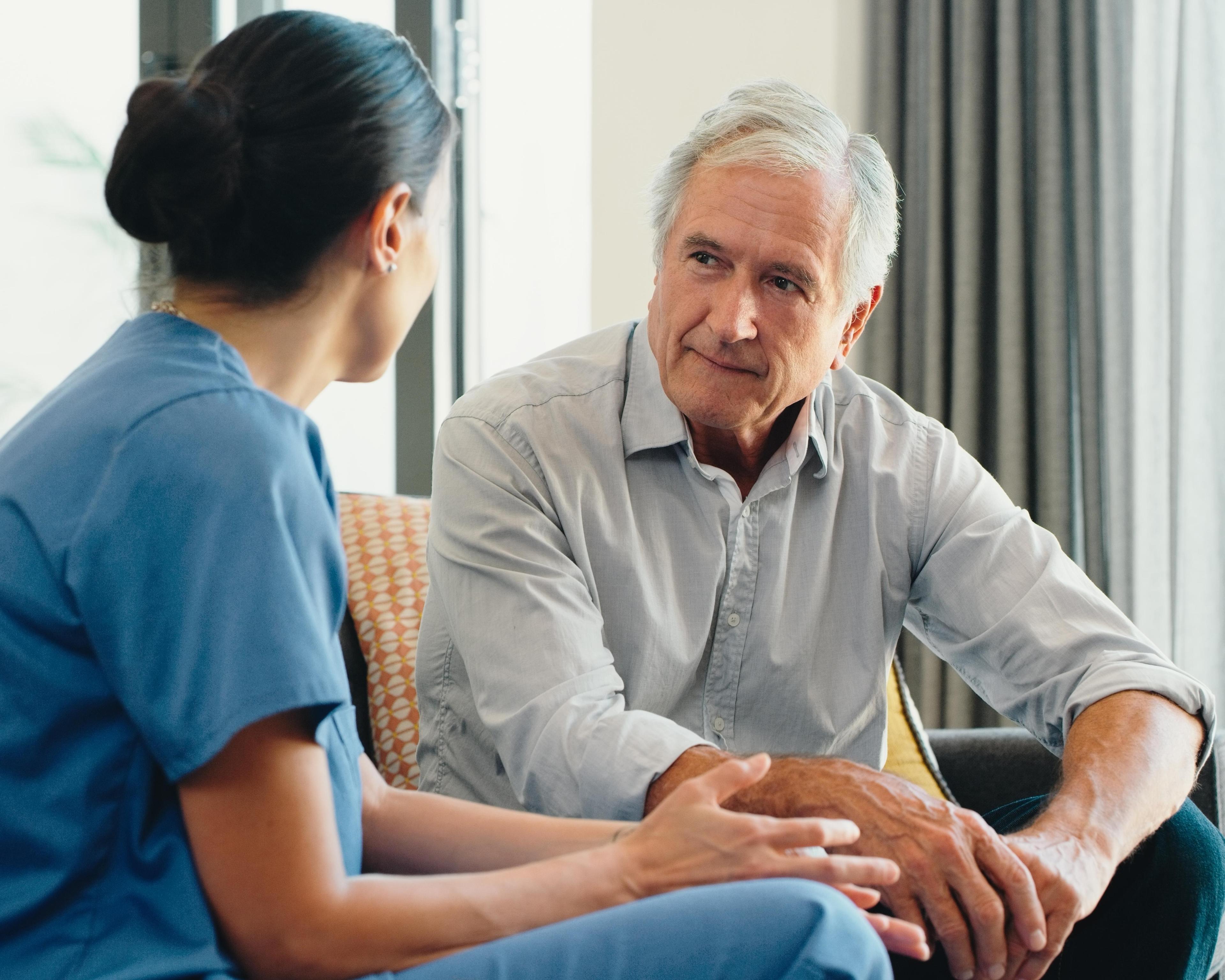 Nurse listening to male patient 1423007805.jpg