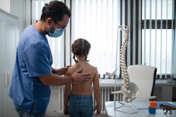 Child's back exam - scoliosis